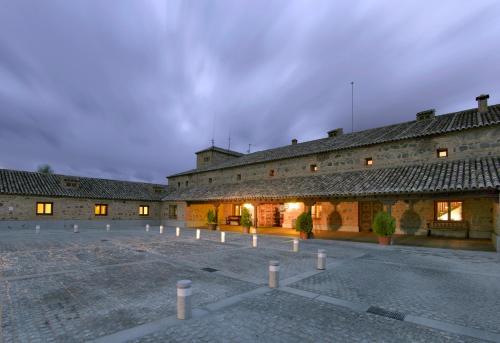 a large building with a clock on the side of it at Parador de Toledo in Toledo
