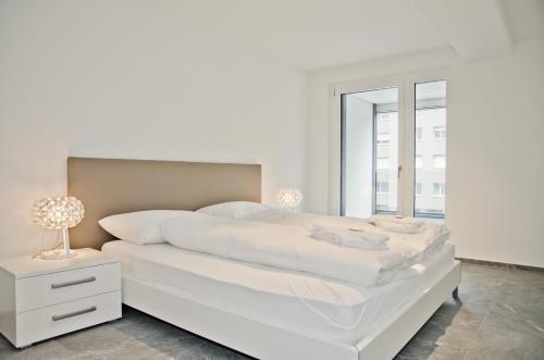Ένα ή περισσότερα κρεβάτια σε δωμάτιο στο Apartment JungfrauCenter Bällenhöchst - GRIWA RENT AG