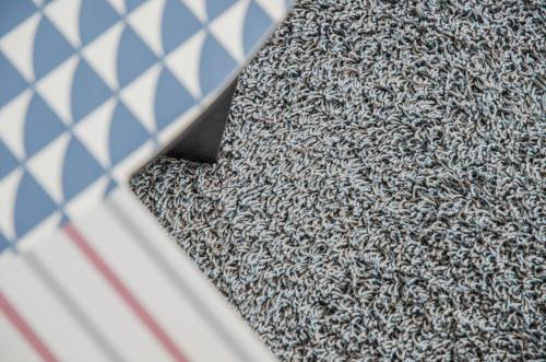 a close up of a rug on a floor at Apartment JungfrauCenter Brienzersee - GRIWA RENT in Interlaken