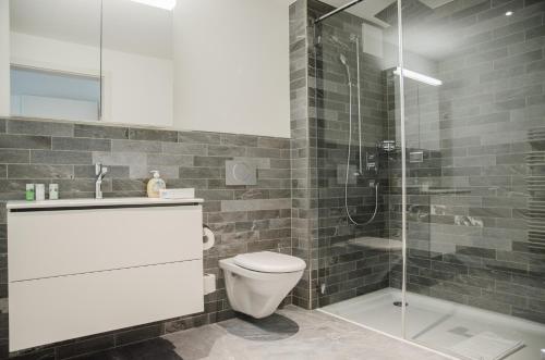 Kylpyhuone majoituspaikassa Apartment JungfrauCenter Brienzersee - GriwaRent AG