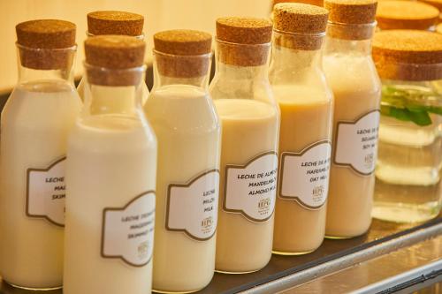 a group of bottles of milk on a shelf at Hotel Playa Golf - Adults Only in Playa de Palma