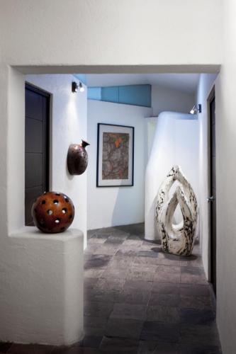 a room with two vases on display in a museum at Aztic Hotel and Executive Suites in Mexico City