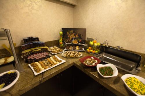 a buffet of food on a counter in a kitchen at Miss Istanbul Hotel in Istanbul