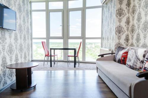 a living room with a couch and a table at Admiral in Kharkiv