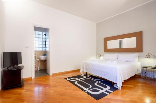 Postel nebo postele na pokoji v ubytování HT Residence Maximus