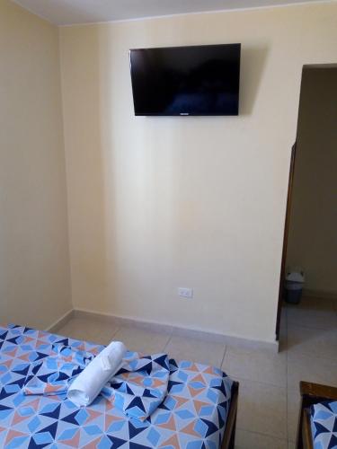 Postel nebo postele na pokoji v ubytování Hotel Táchiras