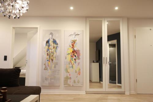 a room with two display cases with dresses on them at Wohnkomfort wie Zuhause in Neubrandenburg