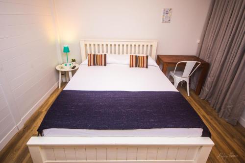 Una cama o camas en una habitación de Pousada Seu Dodó