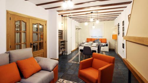 a living room with a couch and a table at Casa Rural LA COVA in Suano