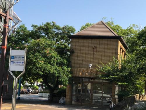 a building with a sign in front of it at Koi Koi in Takamatsu
