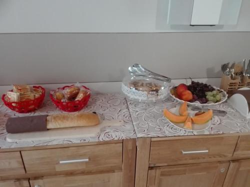 a counter top with a bunch of fruits and vegetables at eden in Cannobio