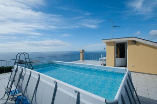 a swimming pool on the roof of a house at Residence Cielo e Mare in Moneglia