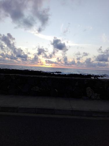 a sunset over the ocean with the sky and clouds at Casa vicente in Santa Cruz das Flores