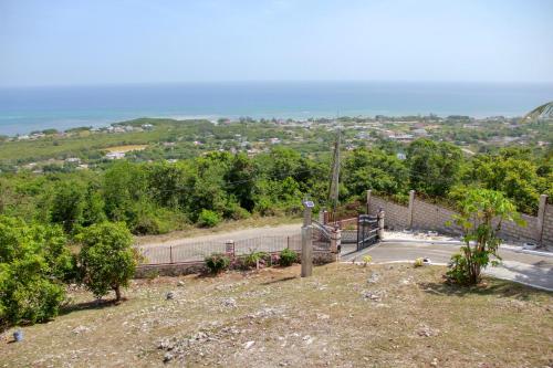 a view from the top of a hill with a road at Sunshine Lodge: Your home away from home in Montego Bay