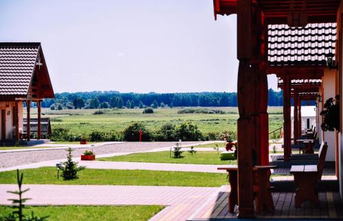 a view of a field from a building at Żwirowa Góra - Domki nad Narwią in Tykocin