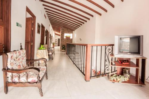TV a/nebo společenská místnost v ubytování Vivienda turística mi sueño Jardín