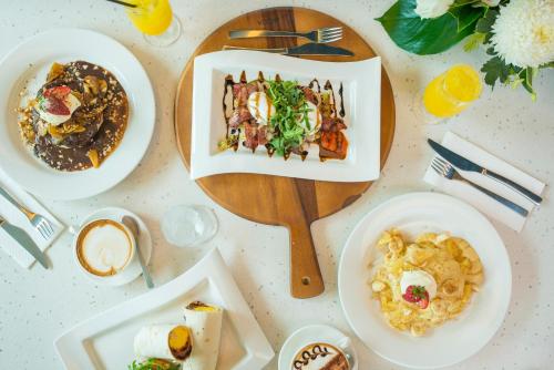 a table with plates of food on it at Port Lincoln Hotel in Port Lincoln