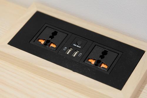 a black electrical switch on a wooden table at karaksa hotel Sapporo in Sapporo
