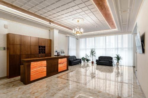 a lobby with a reception desk in a building at Hotel Imperator in Novosibirsk