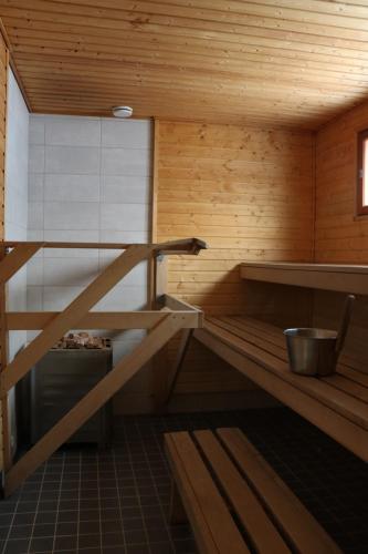 a inside of a sauna with a ladder in it at Youth Center Vasatokka in Inari