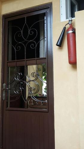 a door with a fire hydrant next to a window at Joniskera in Tbilisi City