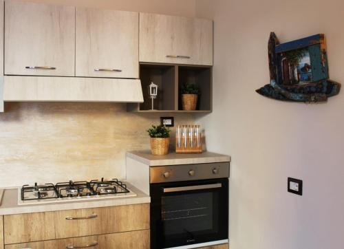 a kitchen with a stove and a stove top oven at Isolabella in Mazara del Vallo