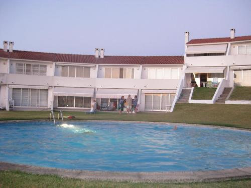 a swimming pool in front of a building at Montanha, rio e mar... in Vila Nova de Cerveira
