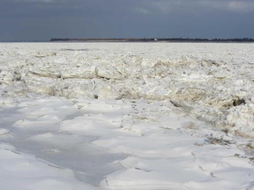 a large icy field with snow on it at Ferienwohnung Werner in Jork
