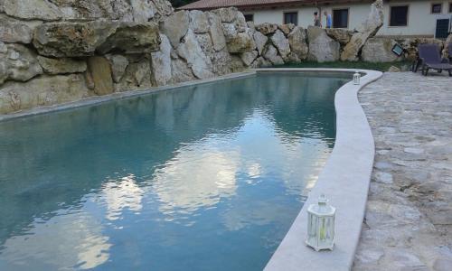 a swimming pool with a light in the middle of it at Valle Dei Pini in Lenola