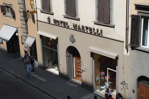 an overhead view of a store with people walking in the street at Hotel Martelli in Florence