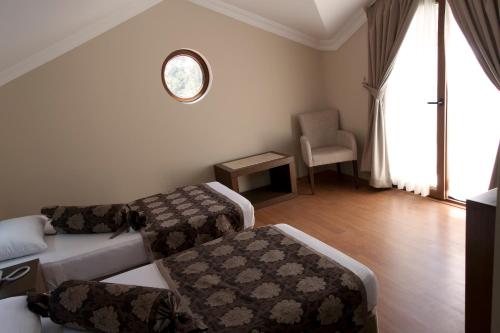 Pine Valley Hotel Oludenizにあるベッド