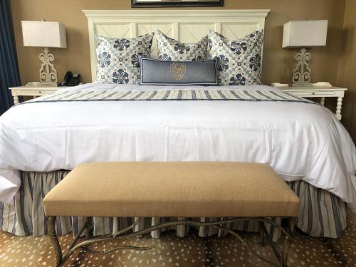 a bedroom with a large bed with two night stands at Frontier Hotel Pawhuska in Pawhuska