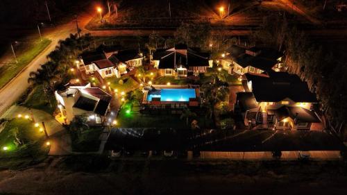 an overhead view of a house with a pool at night at La Loma in Federación