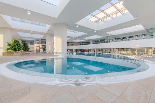 a large pool in the middle of a building at Eurostars Isla de La Toja in Isla de la Toja