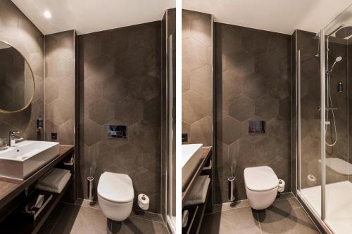 a bathroom with a toilet and a sink and a shower at The James Rotterdam in Rotterdam