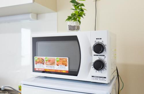 Kuchyň nebo kuchyňský kout v ubytování H-Nishikamata ColorBee House