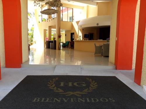 a lobby with a htec bernarios rug on the floor at La Quinta Gran Bahía, Cuastecomates - Todo Incluido in Cuastecomate