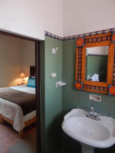 Ένα ή περισσότερα κρεβάτια σε δωμάτιο στο Suites Santo Domingo