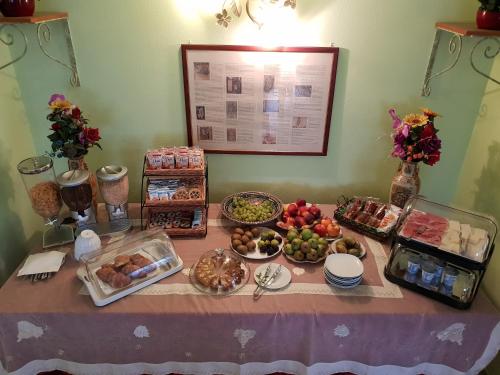 a table with many different types of food on it at Villa Alberta Hotel in Pula
