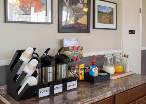 a kitchen counter with a counter top with some food at Silver Ridge Lodge in Salida