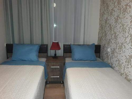 מיטה או מיטות בחדר ב-MANGO Guesthouse