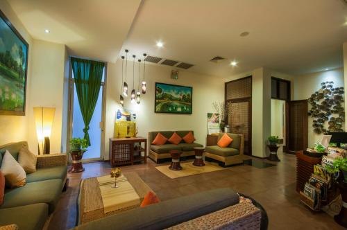 Un lugar para sentarse en Lotus Blanc Hotel