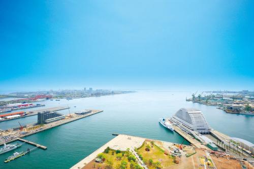 an aerial view of a harbor with a cruise ship at Hotel Okura Kobe in Kobe
