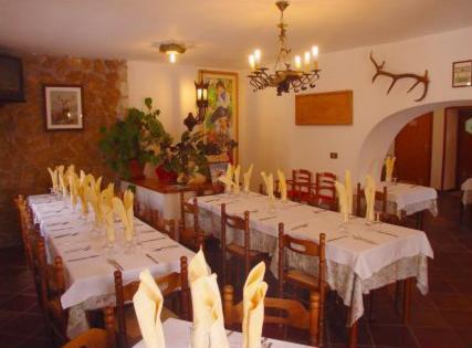 a dining room with white tables and chairs at Genziana B&B by VM in Opi
