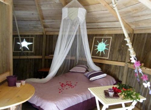 Katil atau katil-katil dalam bilik di Les cabanes du lac du Der