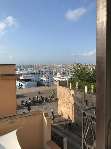 a view of a marina from a building at Palazzo Bolasco in Alghero