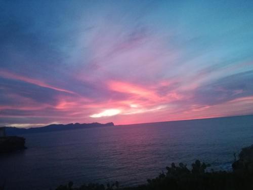 a sunset over a body of water at Case Vacanze Terra Sinus in Terrasini