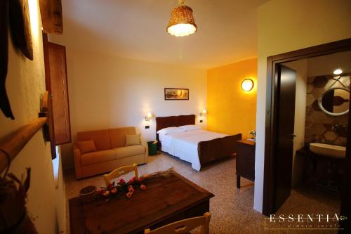Agriturismo Essentia dimora ruraleにあるベッド