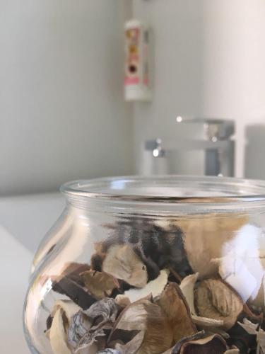 a glass jar filled with mushrooms on a counter at Eirl DOLOMITES Retreat Sappada in Sappada