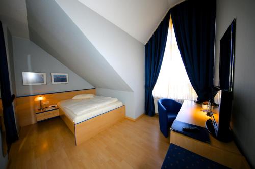 Ένα ή περισσότερα κρεβάτια σε δωμάτιο στο Hotel Chassalla